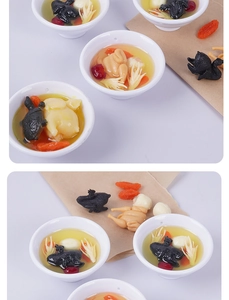 Detail of miniature chicken soup model with goji berries and realistic herbal textures