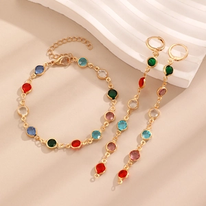 Detailed set of colorful gemstone bracelet and long earrings with gold alloy metal base