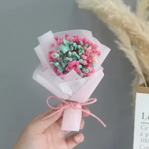 Mini pink and green baby's breath dried flower bouquet with elegant pink ribbon bow decoration