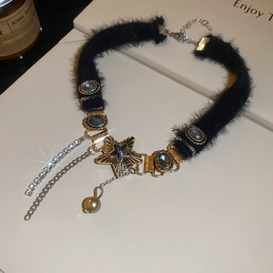 Detail of plush choker with star pendant and sparkling rhinestone tassel fringe