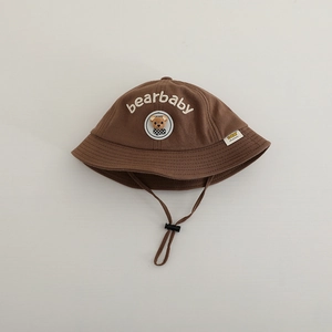 Detail of brown cotton baby sun hat with cute bear embroidery and adjustable windproof cord