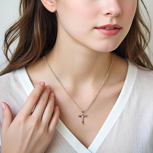 Close-up of S925 sterling silver lava texture cross necklace worn by a female model