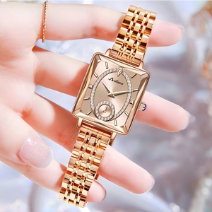 Close-up of rose gold square watch with diamond-set dial and elegant metal strap