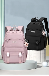 Detail view of pink and black ergonomic backpacks with multi-layer storage and thick straps