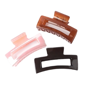 Polished medium square claw clips in amber, pink, and grey for women's hair styling