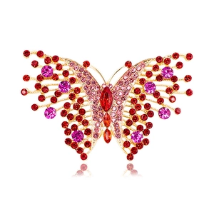 Vintage gold-plated butterfly brooch with sparkling red and pink rhinestones
