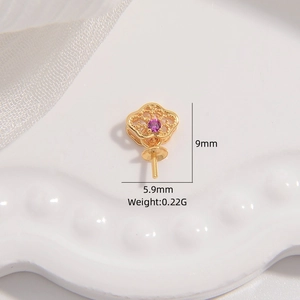 Macro detail of a 9mm x 5.9mm golden petal-shaped earring mount with purple stone