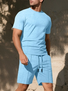 Detail of light blue waffle texture on men's summer short sleeve t-shirt and shorts set