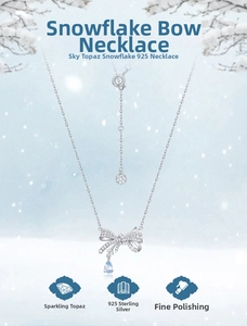 Detailed close-up of S925 silver snowflake bow necklace with a blue topaz drop pendant