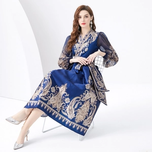 Elegant navy V-neck paisley dress with lantern sleeves and belted waist for resort wear