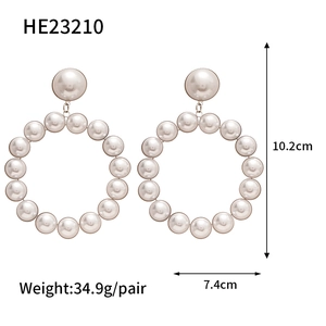 Detailed view of oversized pearl flower earrings with size specs and model number