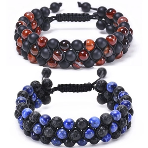 Detail of handmade braided stone bracelets with matte onyx, tiger eye, and lapis beads