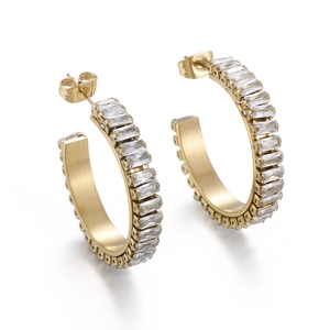 Gold C-shaped earrings with matte finish and baguette-cut white zircons for women