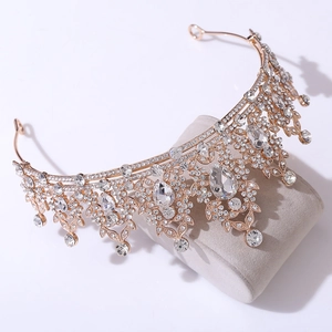 Detailed view of leaf design bridal tiara with sparkling crystals on golden base