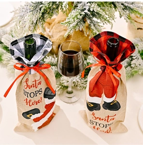 Close-up of Santa Claus plaid wine bottle covers with rustic burlap texture for Christmas