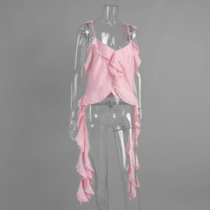 Detailed view of layered pink ruffles and flowing irregular hem on a chiffon top