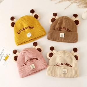 Cozy knit baby winter beanies with cartoon antlers in ginger, coffee, pink, and ivory