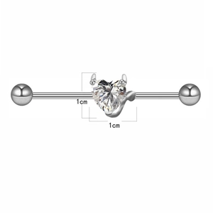 Macro view of silver industrial barbell with devil heart zirconia and 1cm size marker