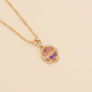 Minimalist gold necklace featuring a sunflower pendant with colorful crystal gradient
