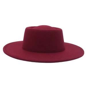 Close-up of wine red wool felt boater hat showing the wide brim and fine stitching detail