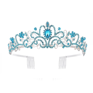Silver bridal crown with intricate floral patterns and sparkling blue crystal accents