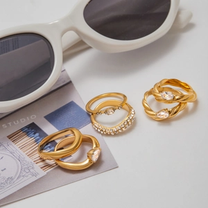 Detail view of gold-plated stainless steel stackable ring set with cubic zirconia stones