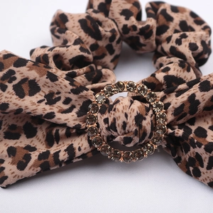 Vintage leopard print bow hair tie with a sparkling rhinestone circular buckle detail