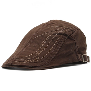 Detail of deep brown cotton ivy cap with artistic embroidery and metal side buckle