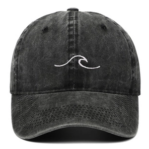 Front detail of charcoal washed cotton baseball cap featuring white wavy embroidery