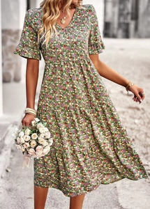 Detail of green floral print A-line maxi dress with short sleeves and waist tie design