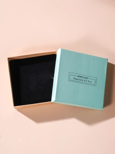 Top view of mint green and pink jewelry gift box with black velvet lining insert