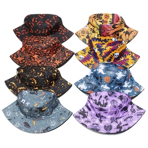 Multiple Halloween bucket hats with pumpkin, skull, and bat prints in various vibrant colors