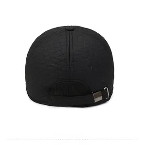 Rear view of black quilted baseball cap showing diamond stitching and metal buckle