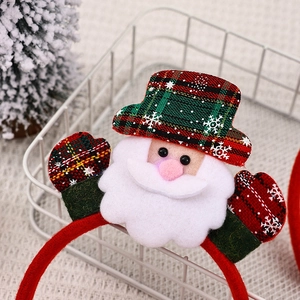 Detail of LED glowing Santa Claus headband with red green plaid hat and soft felt material