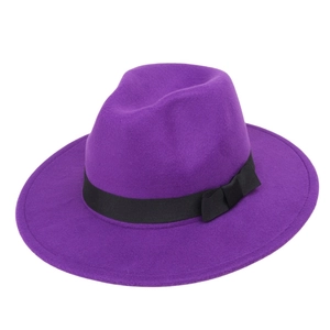 Detail showing high-density purple felt texture and black grosgrain ribbon on the fedora hat