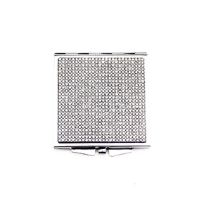 Detailed close-up of a square folding mirror featuring sparkling rhinestones on silver metal