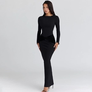 Detail shot of the black slim-fit maxi dress featuring elegant velvet waist patchwork