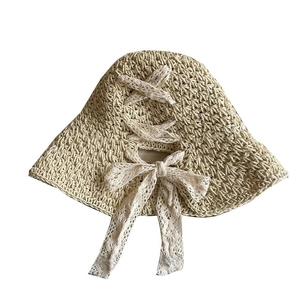Women's foldable straw sun hat with lace bow and crochet hollow design in beige