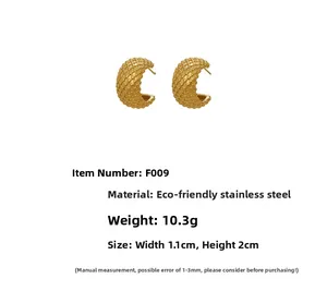 Detail shot of gold-plated C-shape earrings showing grid texture and product dimensions