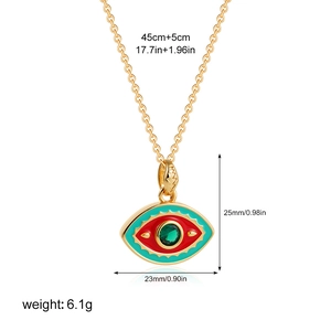 Detail of 18K gold evil eye pendant with teal enamel and green crystal including dimensions