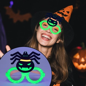 Close-up of neon green spider Halloween glasses frame for children party costume props