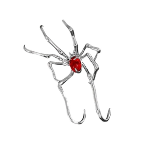 Gothic silver spider ear cuff with red oval gemstone in a minimalist dark design style