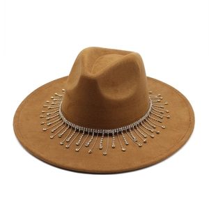 Detail of camel suede bridal hat featuring luxury silver rhinestone fringe and wide brim