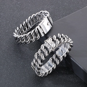 Detailed view of silver stainless steel chunky Cuban link chain bracelet with clasp