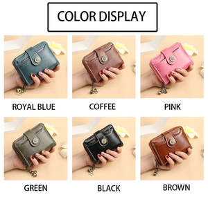 Short leather wallets for women shown in six colors with decorative tassel and metal chain