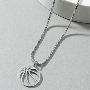 Minimalist silver stainless steel necklace with hollow basketball pendant on grey background