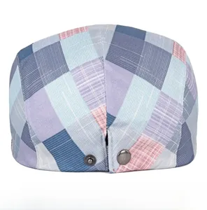 Detail view of colorful plaid ivy cap featuring metal adjustable buckle on the back