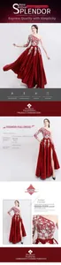 Detail view of red one-shoulder evening gown featuring white floral embroidery and satin fabric