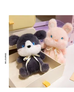 Close-up of plush husky and pink rabbit soft toys with Woody Friends ribbon detail