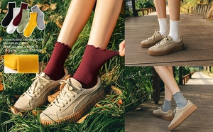 Detailed knit texture and ruffle edge of mid-calf socks shown in natural outdoor settings